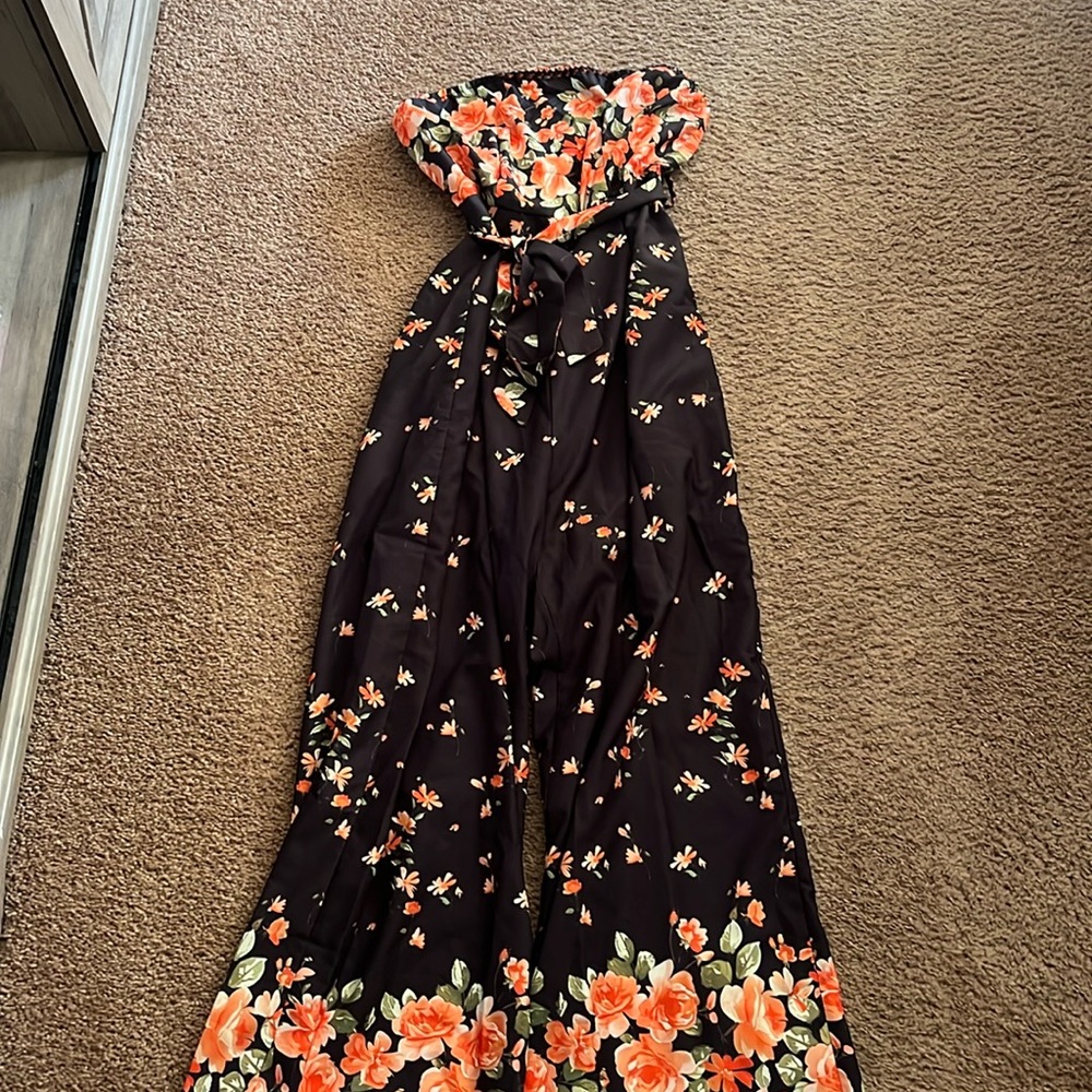Black Jumpsuit with Floral Print. Never worn from SHEIN. Lightweight material.